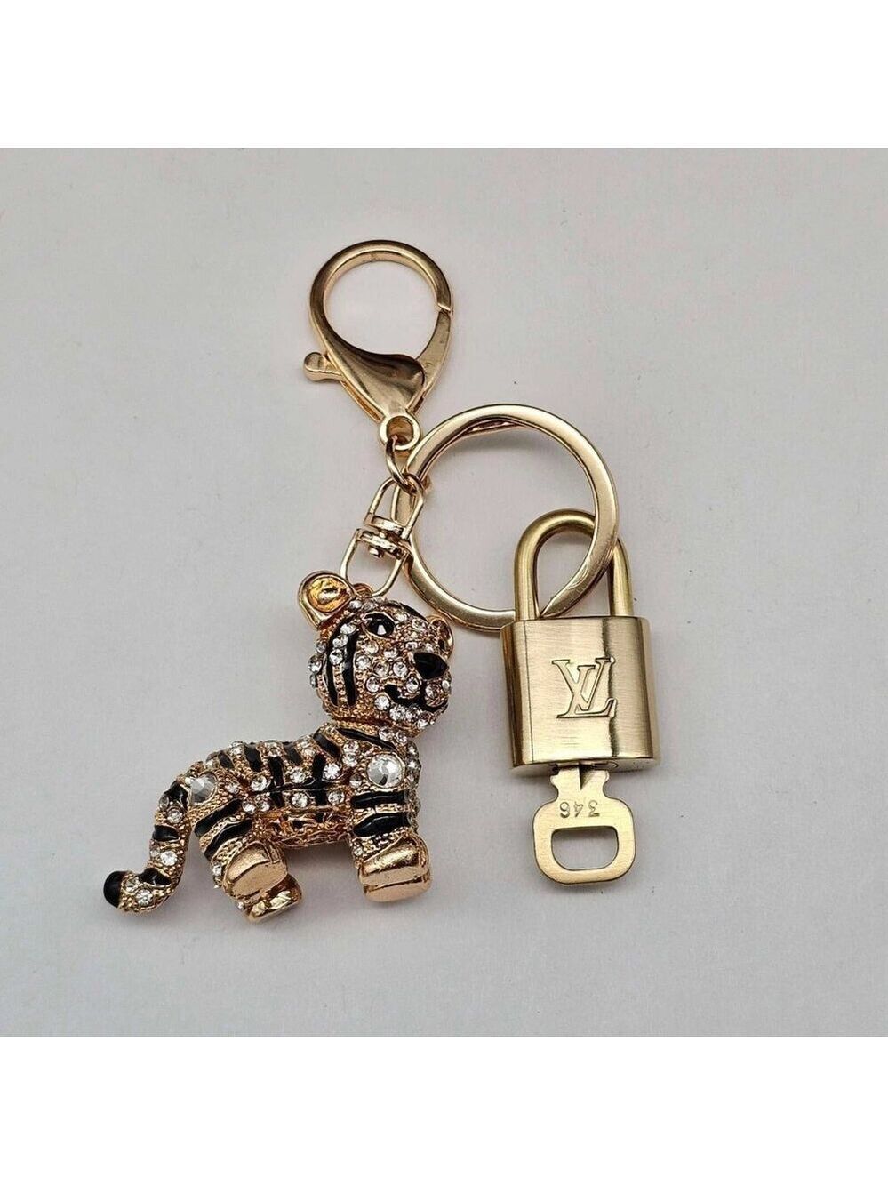 Authentic Louis Vuitton Lock & Key with unbranded Tiger Bagcharm, Keycharm